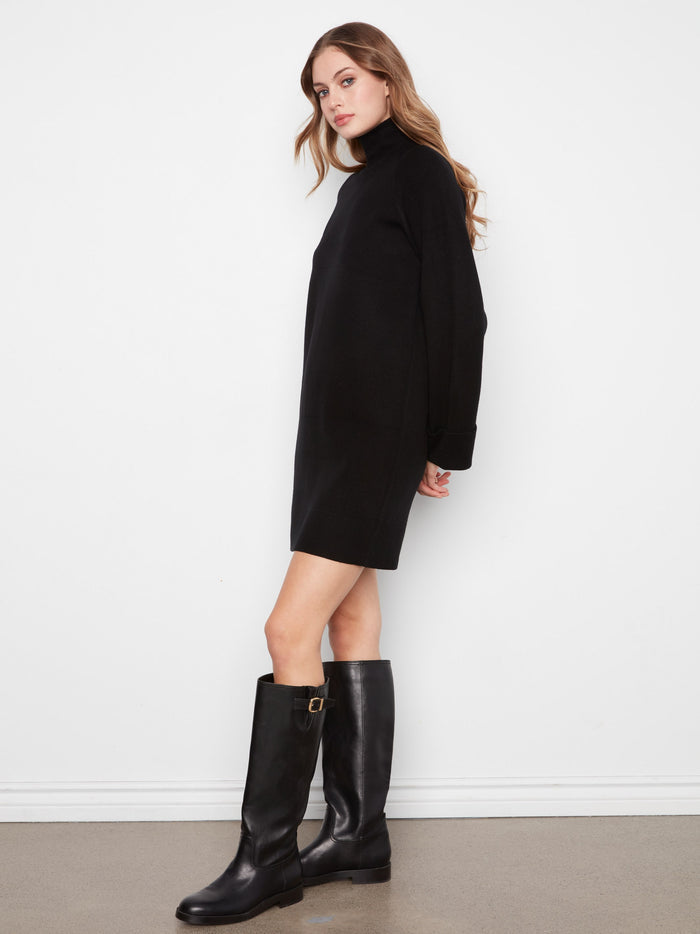 Stylish black sweater dress with long raglan sleeves and a flattering mini length. Perfect for any occasion by Charlie B.