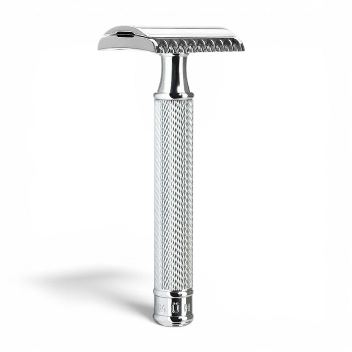 Angled view of MÜHLE R41 chrome open comb safety razor with textured handle