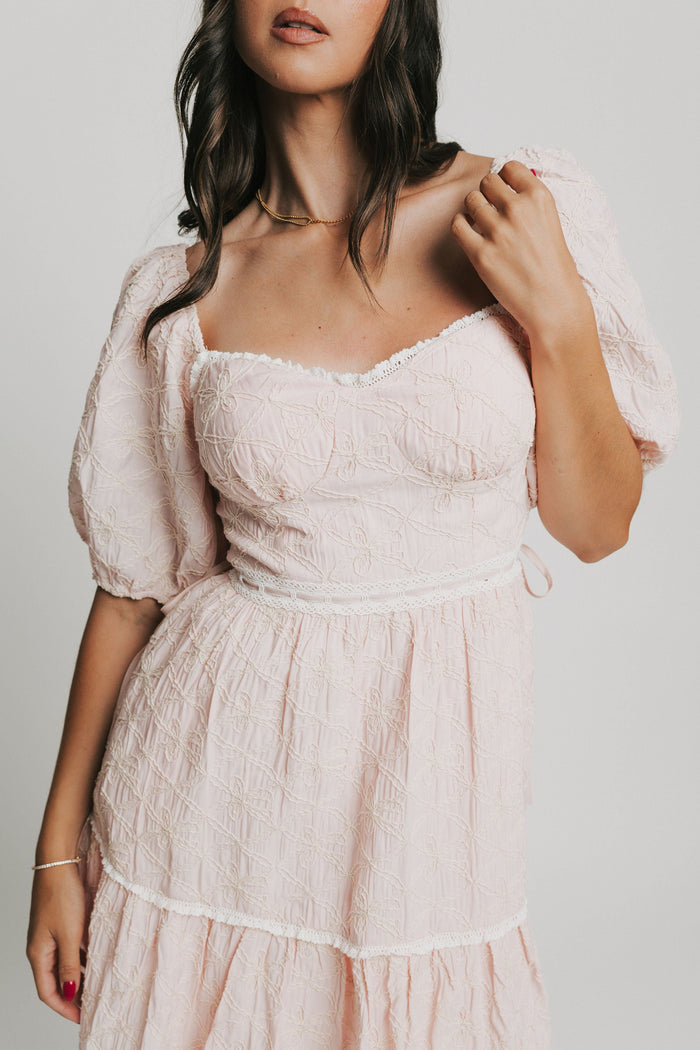 pink bow patterned mini dress with white lace trim