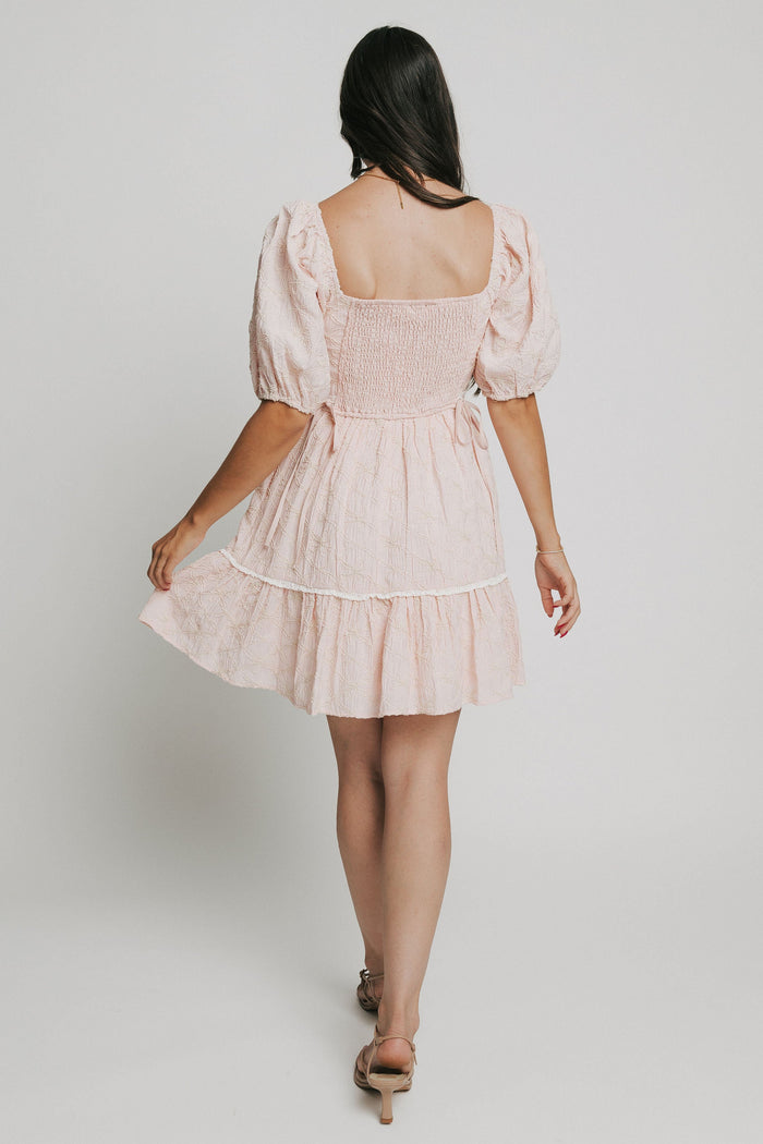 pink bow patterned mini dress with white lace trim
