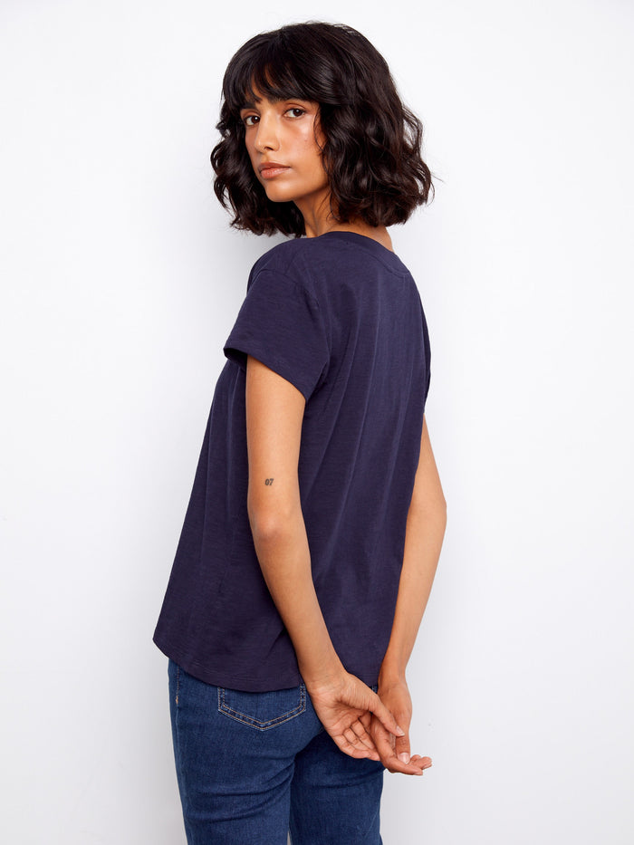 A must-have wardrobe staple, this comfy drop shoulder tee offers both style and breathability in soft cotton. By Charlie B.