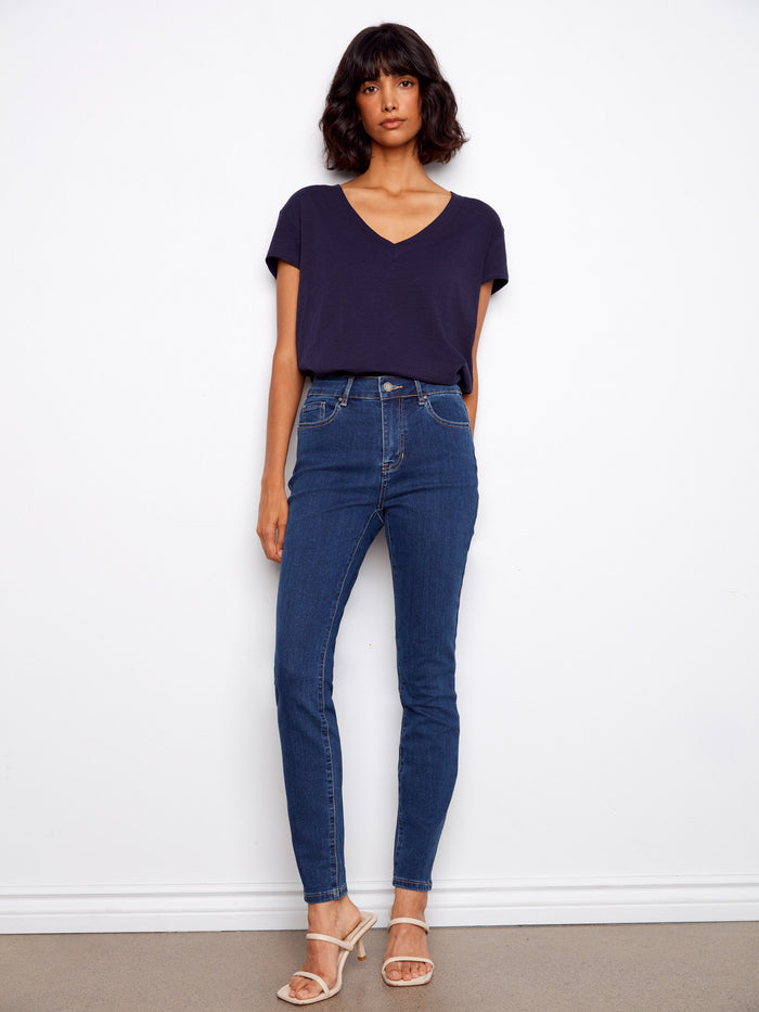 Stay cool in this fashionable V-neck tee made from lightweight fabric, perfect for layering or wearing alone. By Charlie B.