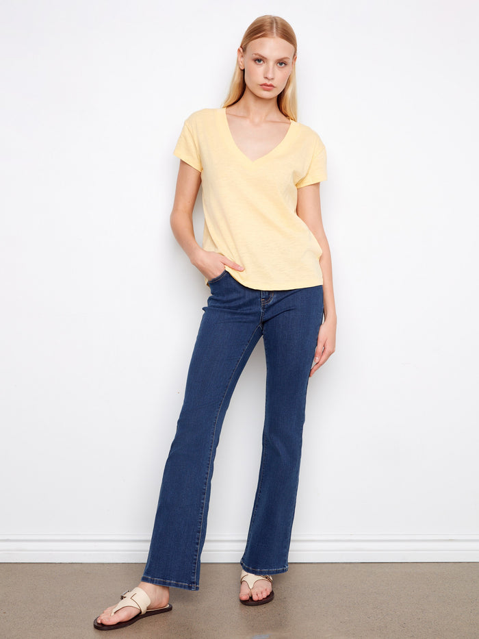 Elevate your casual look with the drop shoulder detail on this versatile yellow t-shirt made from soft cotton fabric. By Charlie B.