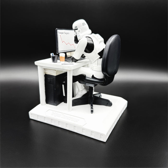 Original Stormtrooper Slave to the Wage figurine rear view showing a Stormtrooper at a desk with computer, coffee cup and declining target chart on screen
