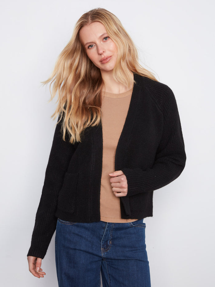 Chic black cardigan with raglan sleeves for a relaxed fit, complete with patch pockets by Charlie B.