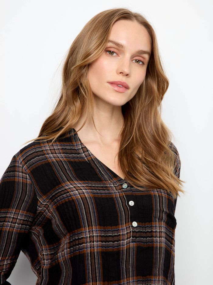 Enjoy the comfortable fit of this plaid shirt with its Henley neckline and modern design elements by Charlie B.