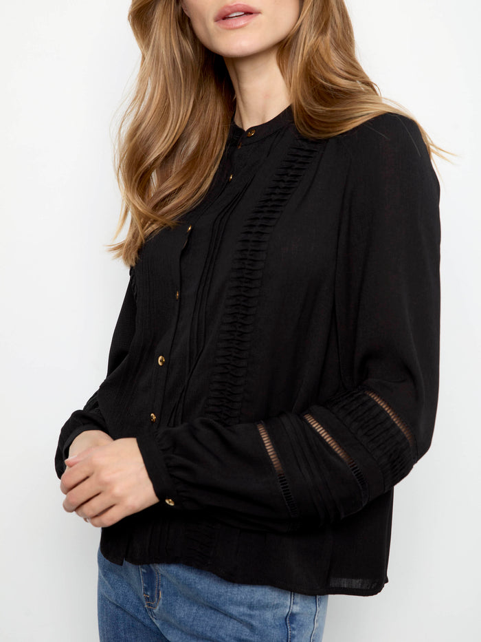 Stylish blouse featuring knife-pleat detailing and long sleeves, ideal for any occasion by Charlie B.