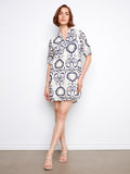 The dress features a chic chest pocket, adding both style and functionality to the overall design by Charlie B.