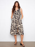 Abstract print dress featuring a V-neck and hidden pockets, perfect for a chic look by Charlie B.
