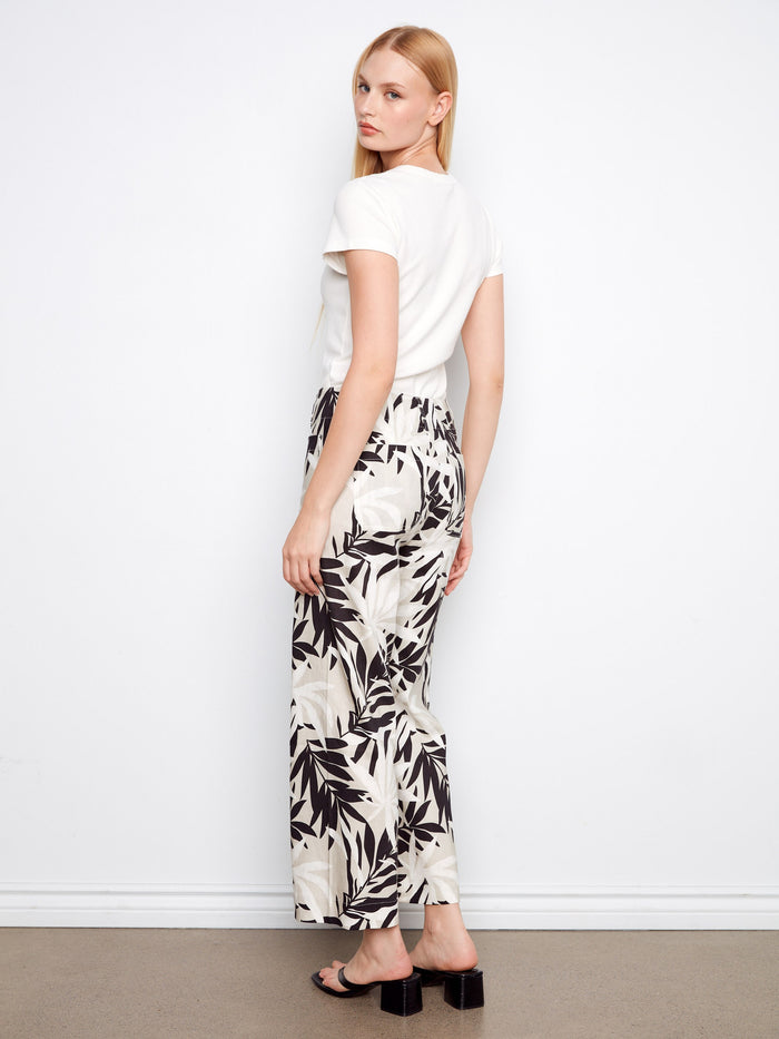 Stretch linen blend cropped pants with bold black and white leaf print, offering comfort and style by Charlie B.