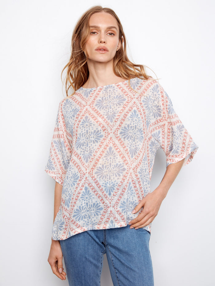 This top features a crew neckline, offering a classic and versatile style. Made by Charlie B.