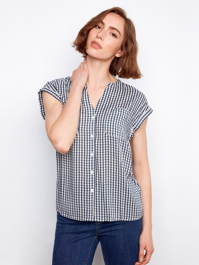 Navy gingham blouse with V-neck and stand collar, featuring a button-up design for a classic touch by Charlie B.