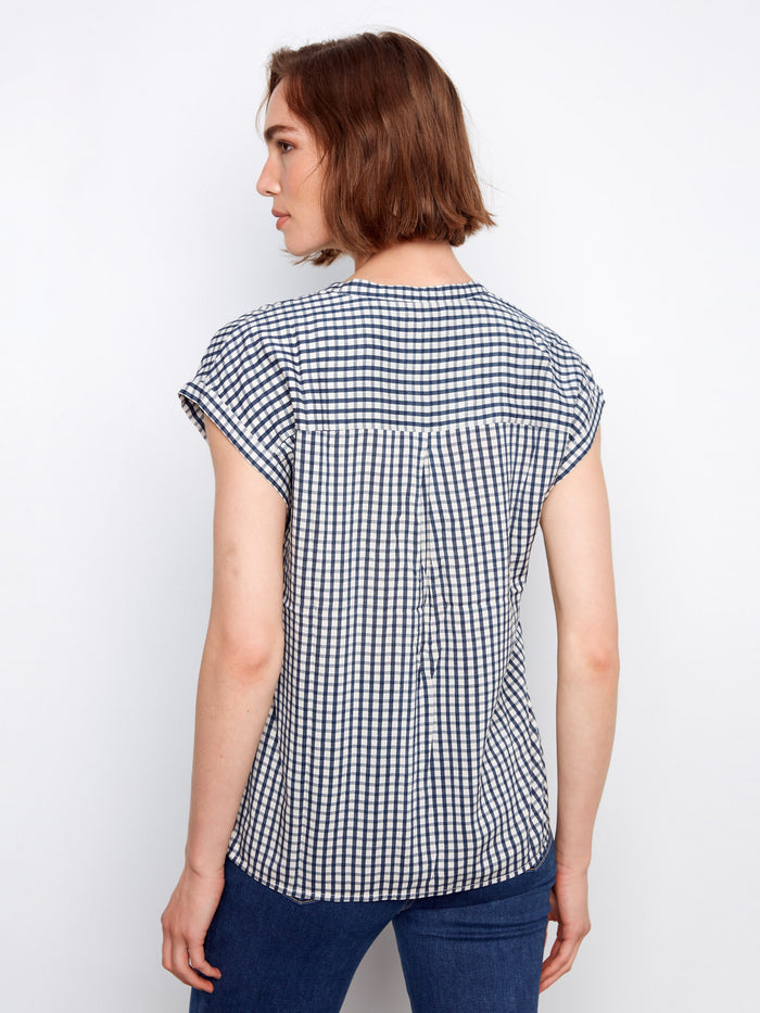 Navy gingham shirt with a modern V-neck and stand collar design, complete with cap sleeves by Charlie B.