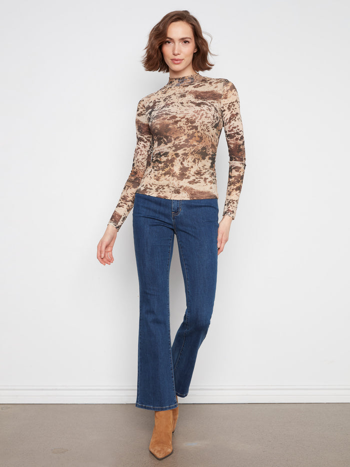 Made from stretch mesh fabric, this top offers a comfortable fit with its stylish mock neckline. By Charlie B.