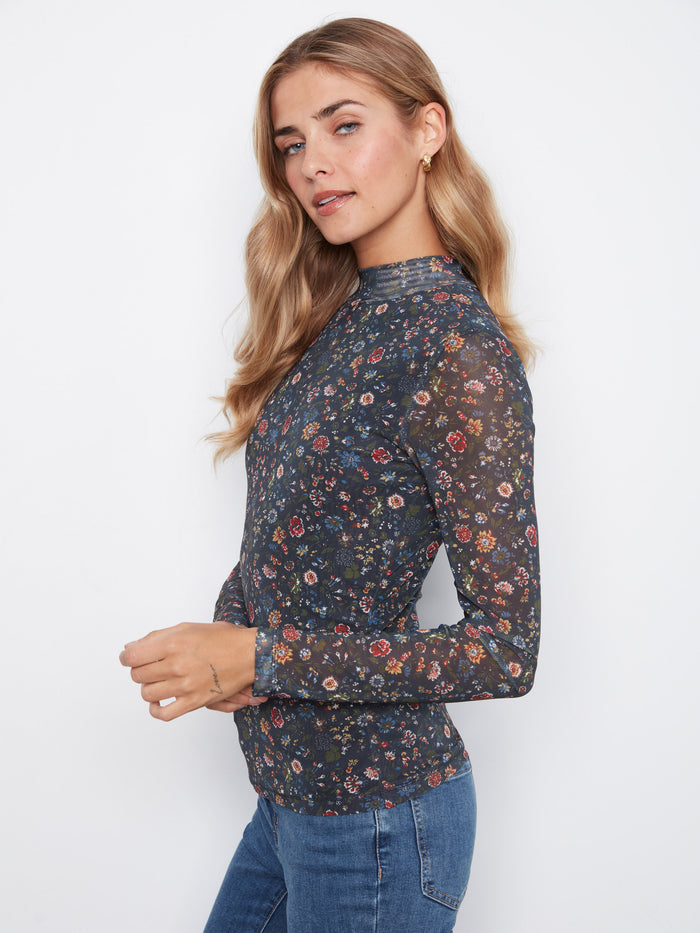Designed in stretch mesh fabric, this top ensures comfort and style by Charlie B.