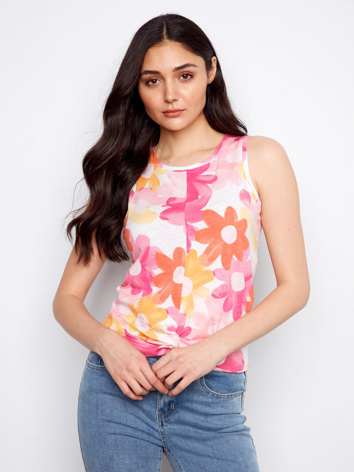 Vibrant floral tank top with an eye-catching twist detail at the front adds a playful touch by Charlie B.