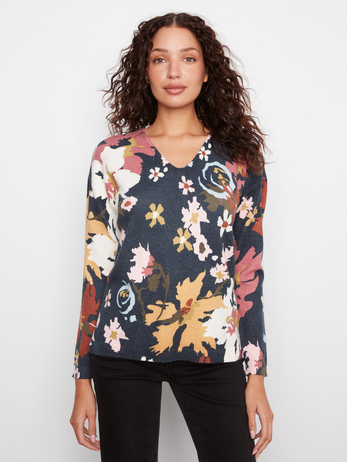 Chic drop shoulder sweater adorned with colorful floral prints by Charlie B.