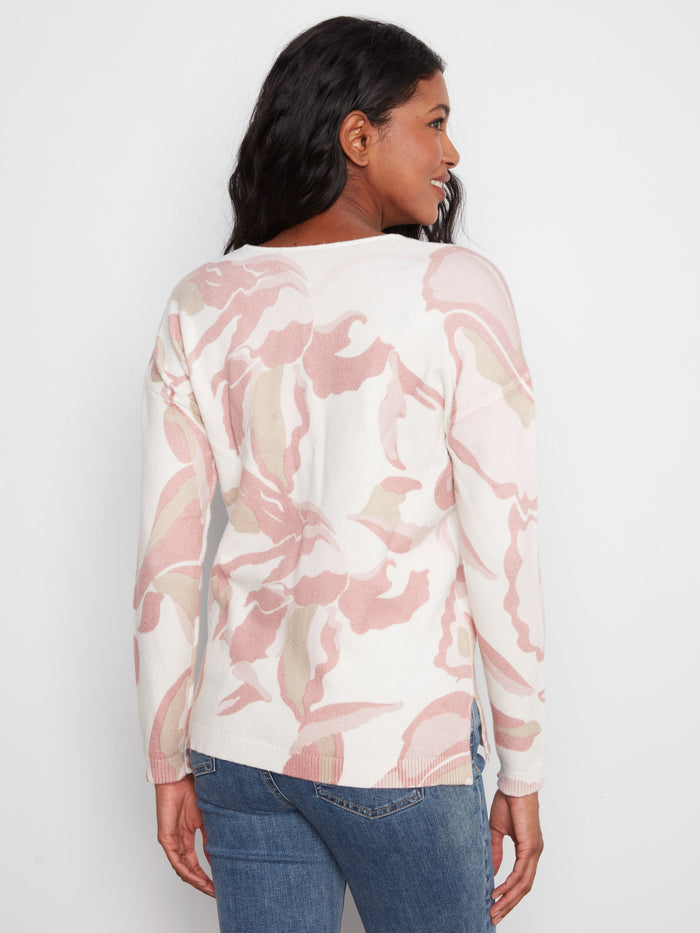The side slits on this sweater provide ease of movement and a trendy look, making it a versatile piece for any occasion by Charlie B.