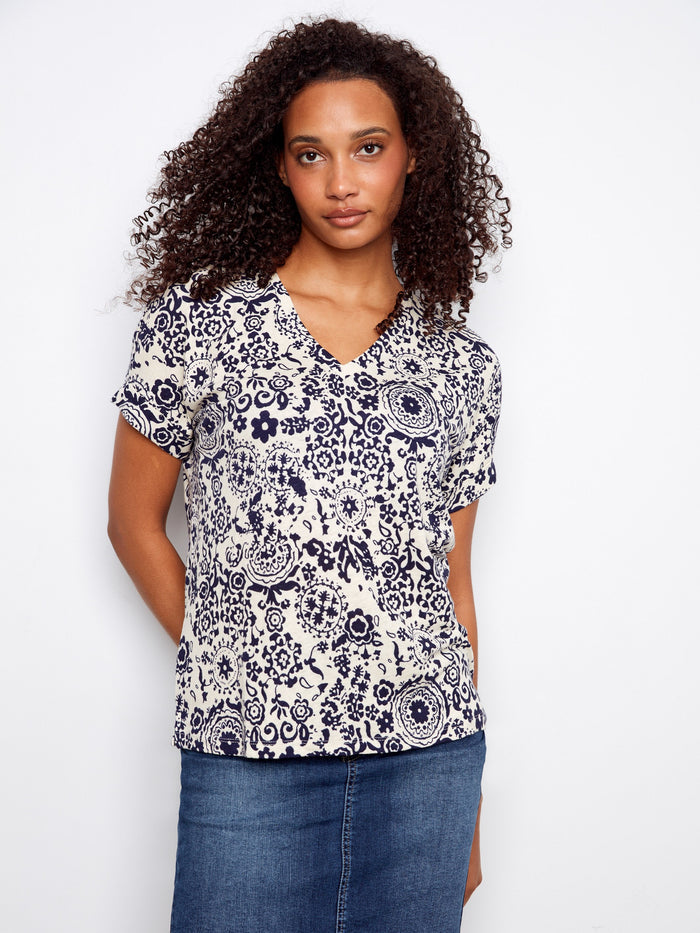 Elegant patterned blouse in a breathable linen blend, perfect for versatile styling options. By Charlie B.