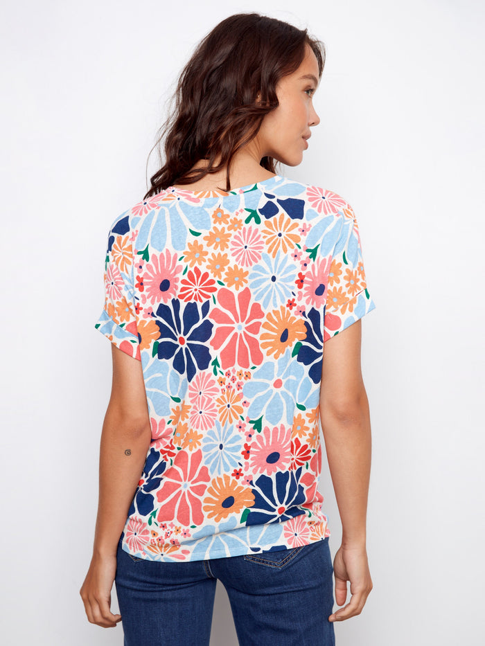 Colorful floral pattern with folded cuff details adds charm to this comfortable linen blend tee by Charlie B.