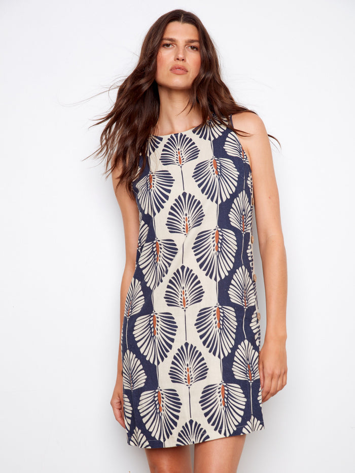 Dress featuring side button detail adds a unique touch to the overall look, enhancing its visual appeal. By Charlie B.