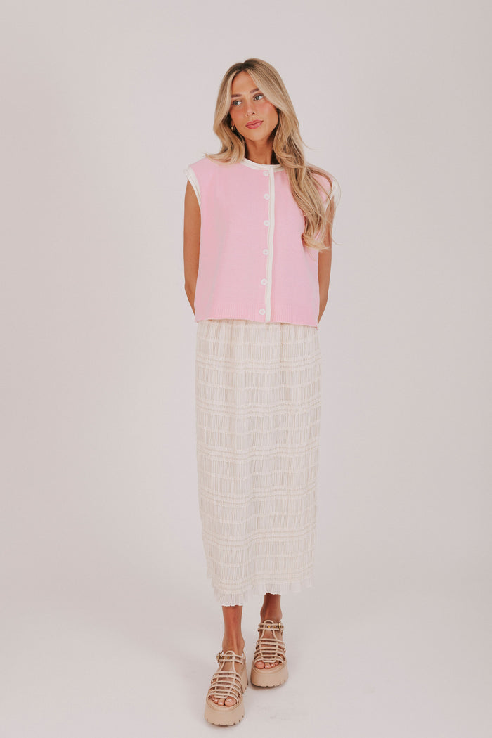 Pink sleeveless button down knit top with contrast rolled edges