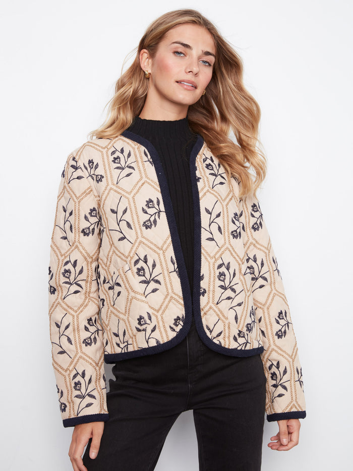 Open front jacket with intricate floral patterns, perfect for layering over casual outfits. Designed by Charlie B.