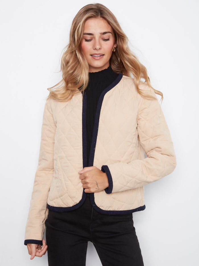 Reversible quilted jacket offering versatile style options, ideal for any season. Crafted by Charlie B.