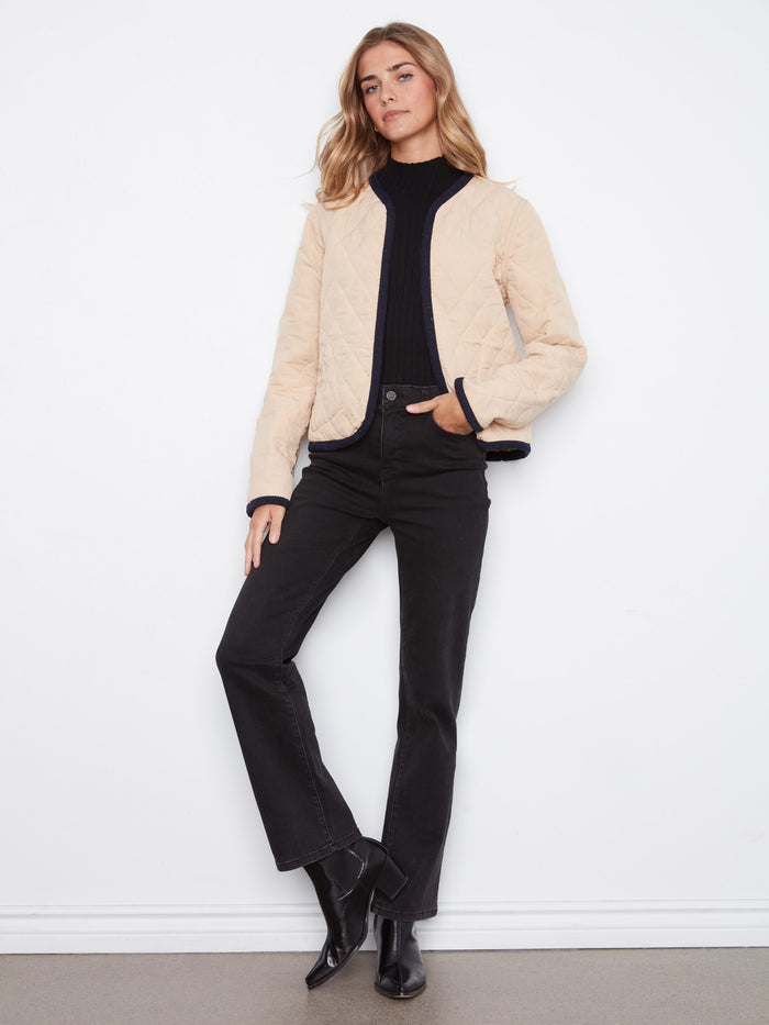 This chic reversible design adds a modern touch to your wardrobe essentials with its unique features. By Charlie B.
