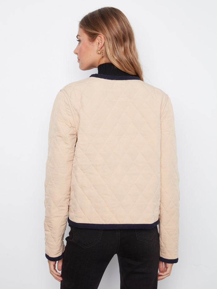 Patch pockets add practicality to this fashionable piece, blending utility and elegance effortlessly. By Charlie B.