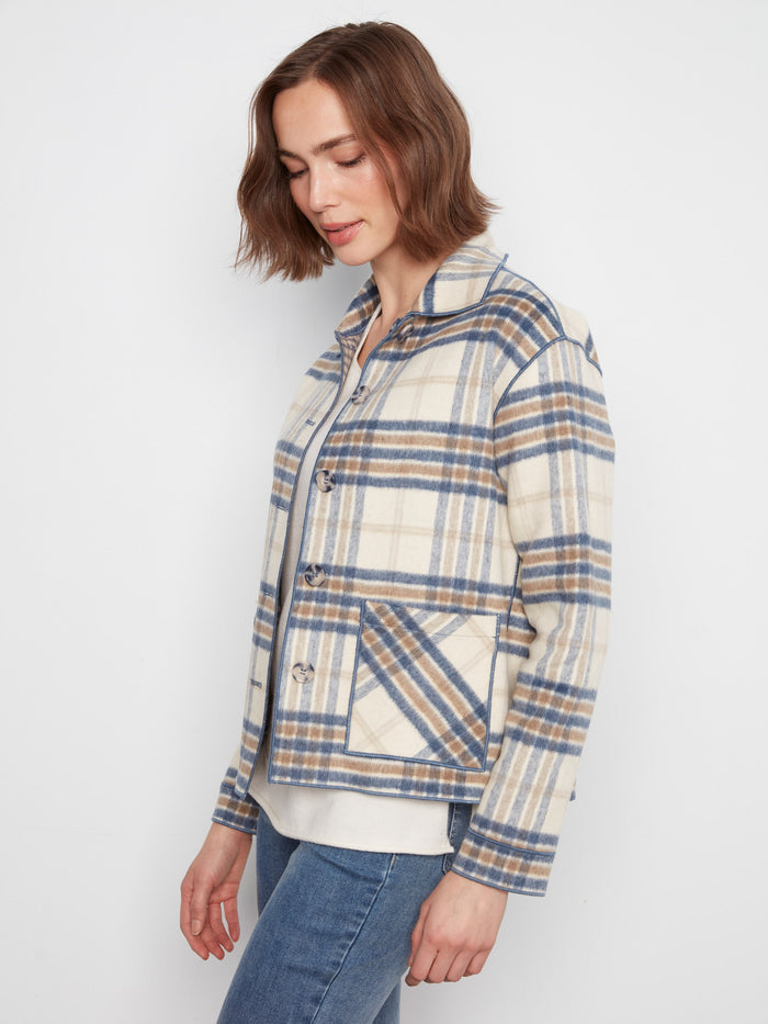 Trendy plaid outerwear showcases practical patch pockets for everyday essentials. By Charlie B.
