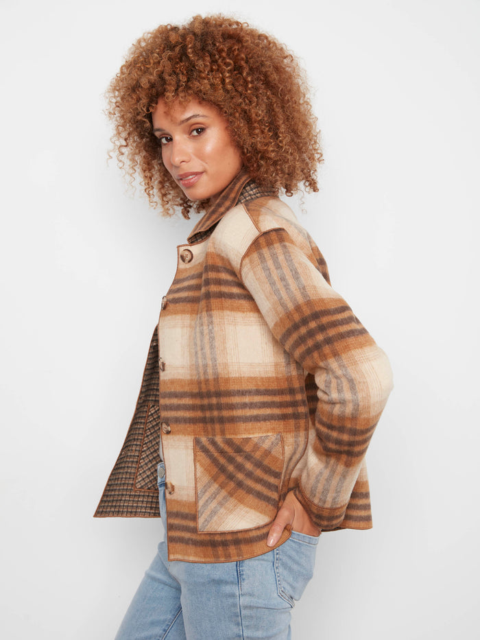 Plaid jacket crafted with attention to detail, including practical patch pockets. By Charlie B.