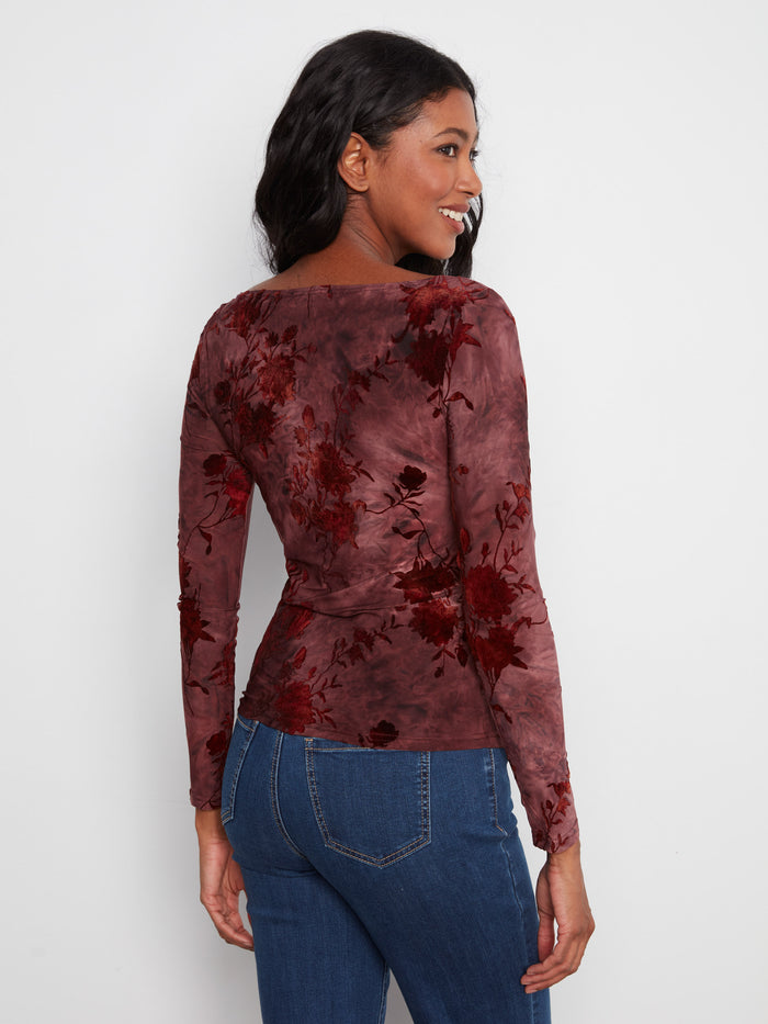 Stylish top with intricate floral patterns and long sleeves, offering both comfort and elegance for cooler days. By Charlie B.
