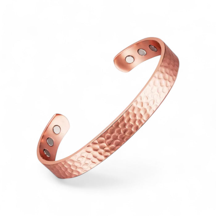 Hammered copper cuff bracelet on white background