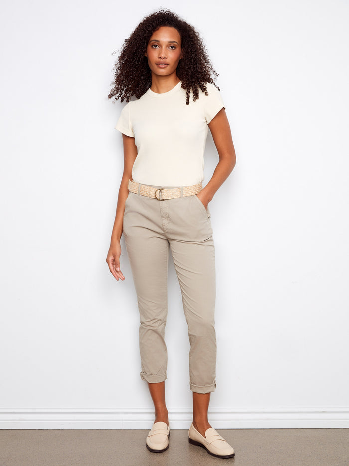 These pants feature a slim fit for a sleek silhouette, perfect for any casual outing. By Charlie B.