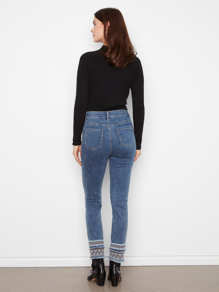 Crafted in premium stretch denim for comfort, these medium blue slim-leg jeans feature unique embroidery accents by Charlie B.
