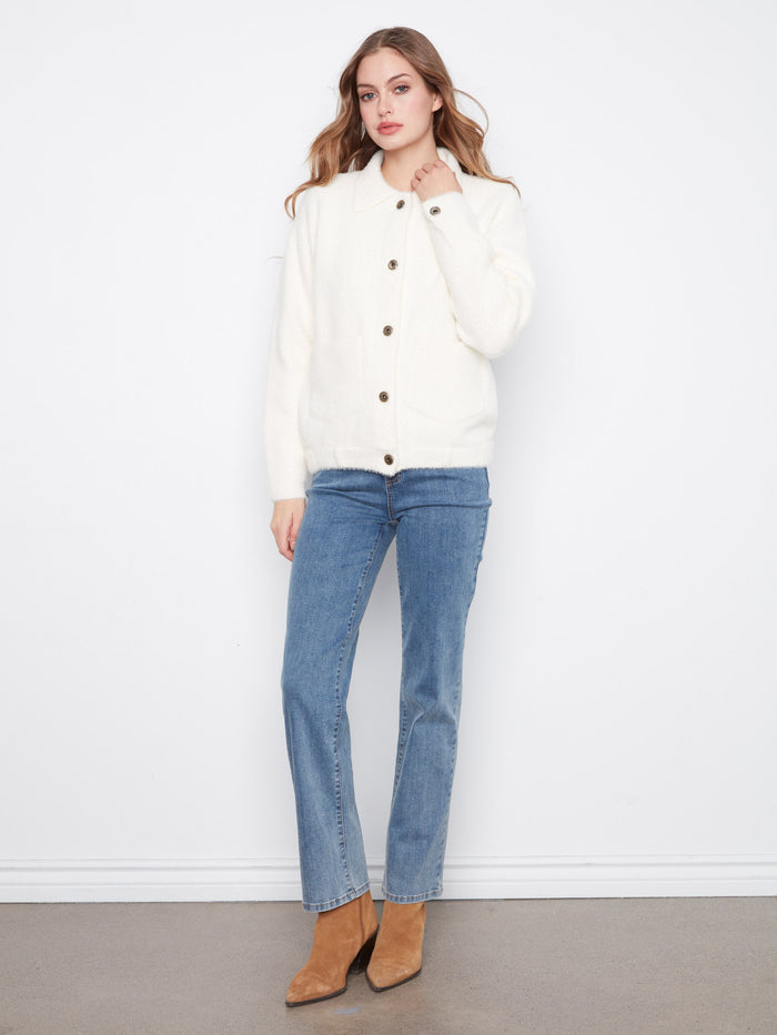 This soft fuzzy knit jacket offers warmth and comfort, ideal for chilly days. By Charlie B.