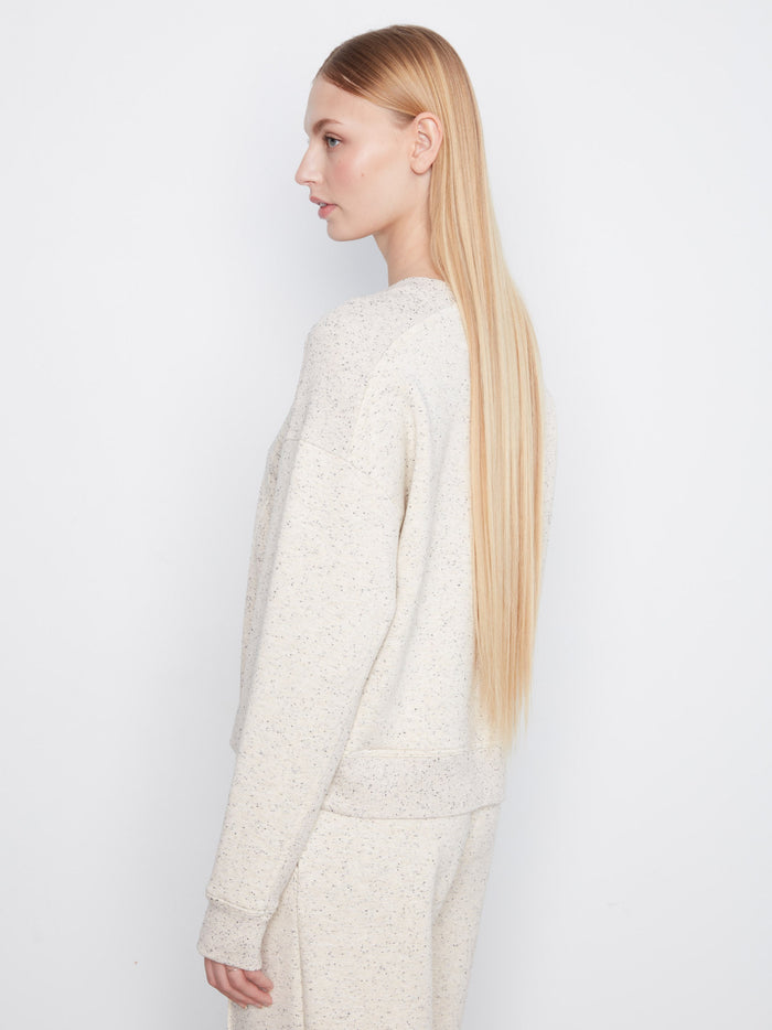 Soft scuba fabric offers both warmth and breathability in this chic top. By Charlie B.