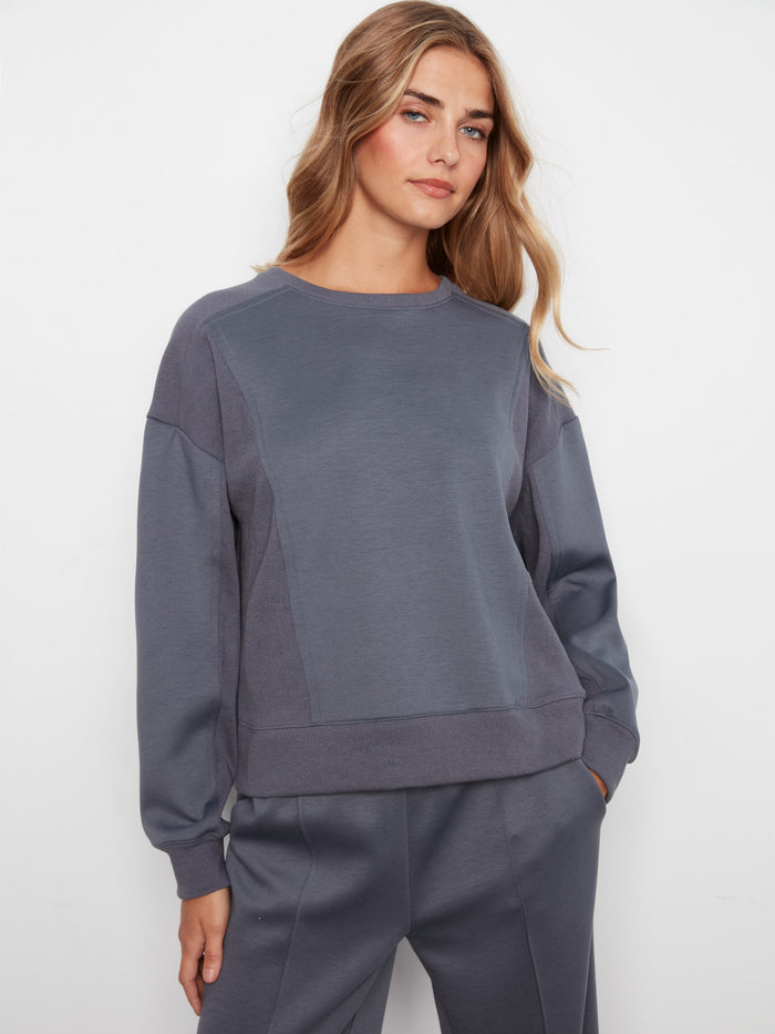 Soft scuba fabric sweatshirt with a relaxed fit, showcasing a cozy crew neck design for everyday comfort by Charlie B.
