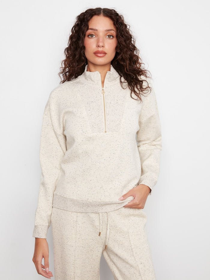 This half-zip mock neck features long sleeves and a relaxed fit, making it an essential piece for cozy days. By Charlie B.
