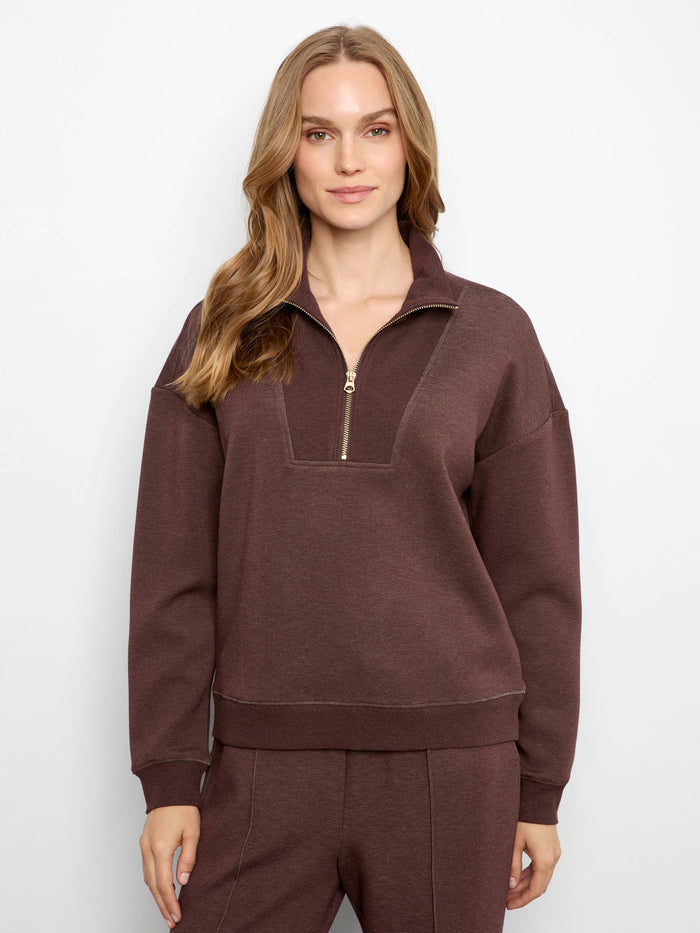 This outfit features a half-zip mock neck, perfect for versatile styling. Crafted in soft scuba fabric by Charlie B.