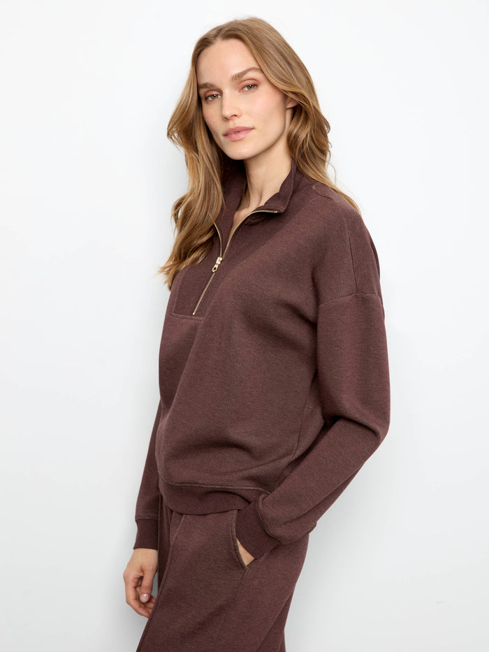 Long sleeves enhance the comfort and style of this piece, making it ideal for any casual occasion. By Charlie B.