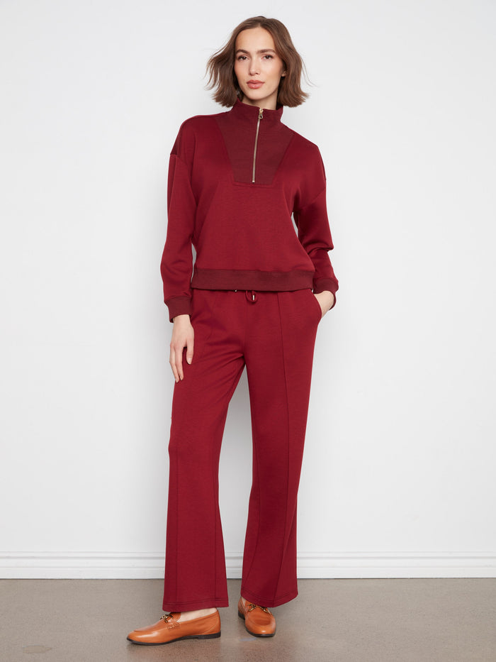 Brown half-zip sweatshirt with ribbed cuffs and hem, offering comfort and style by Charlie B.