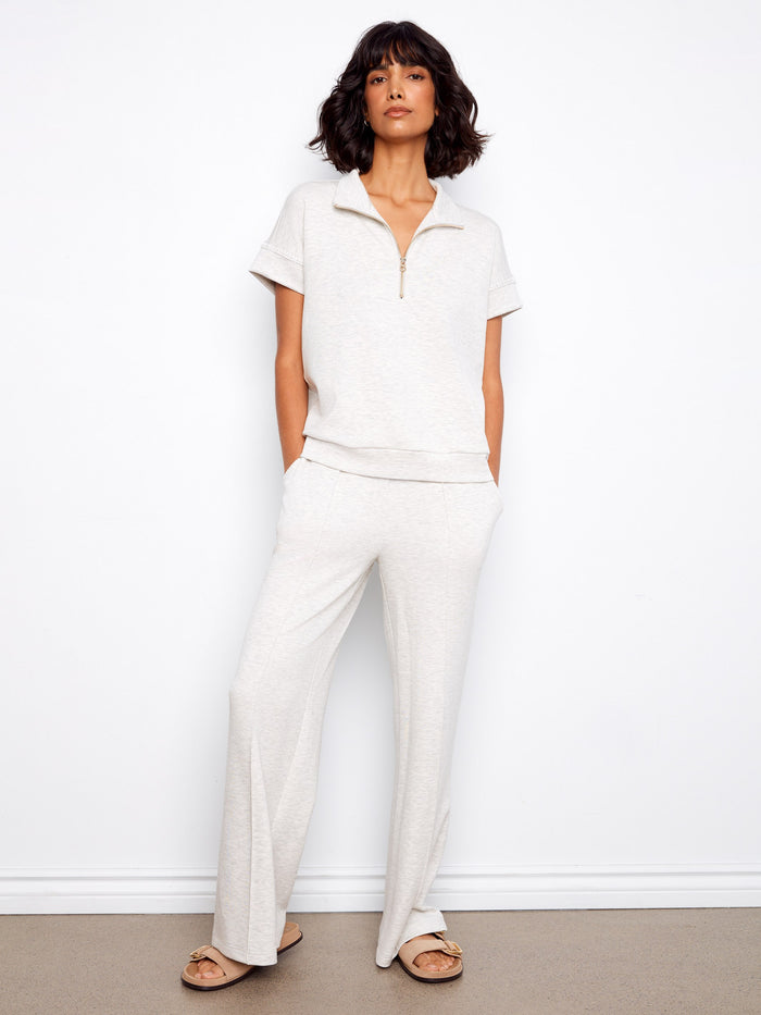 A modern take on the classic short sleeve design in heather light grey, featuring sleek half-zip detailing by Charlie B.