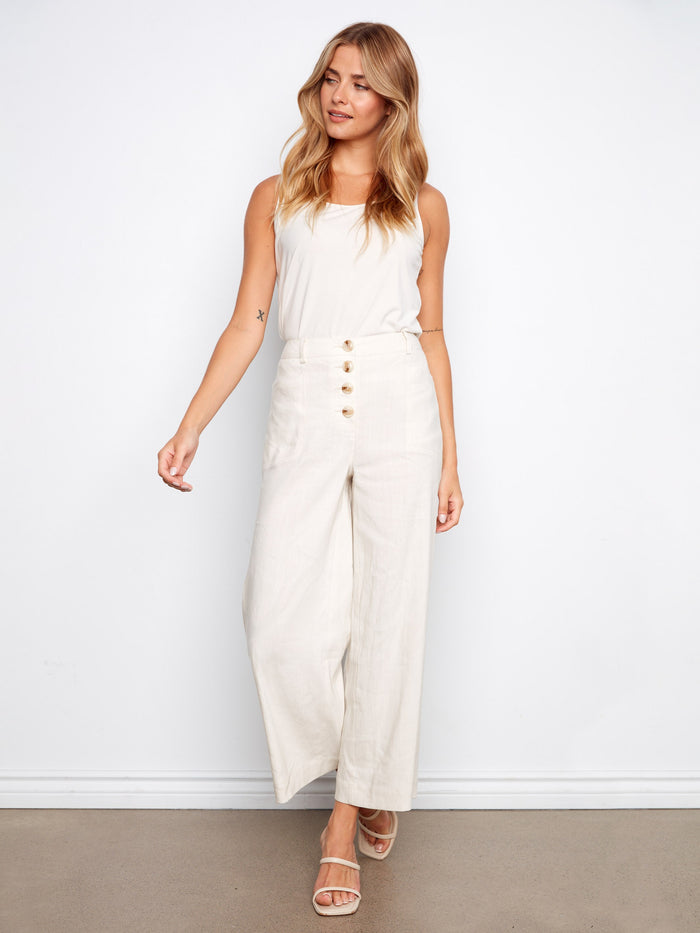 These pants feature a wide leg fit, offering a relaxed and stylish silhouette for any occasion by Charlie B.