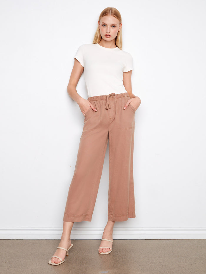 These pants feature a wide leg design, offering a relaxed and stylish look for any casual outing. By Charlie B.