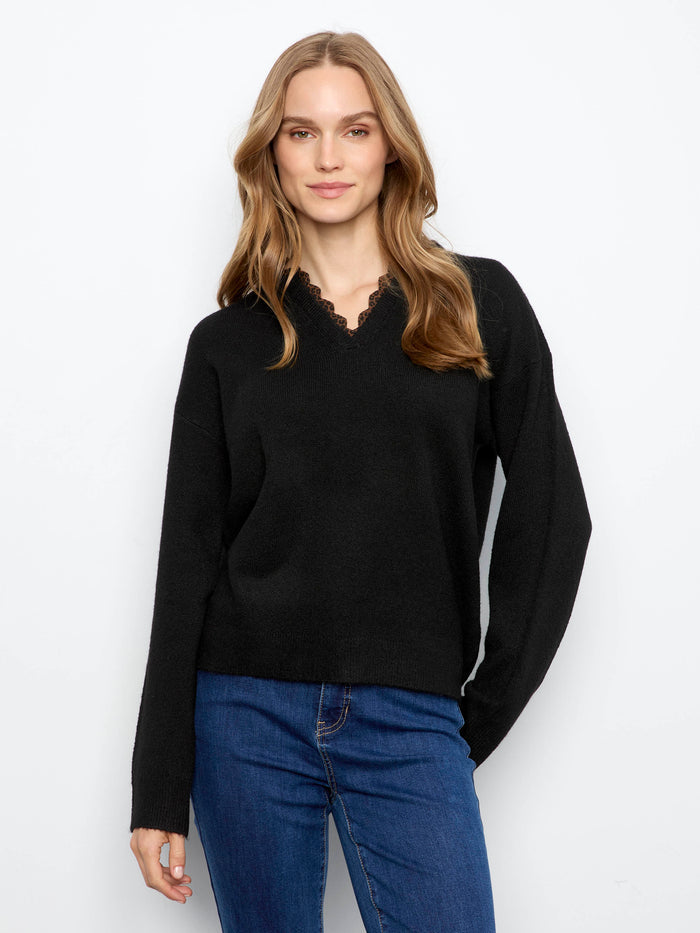 Black sweater with a stylish V-notch neckline featuring leopard print trim, ideal for a chic look by Charlie B.