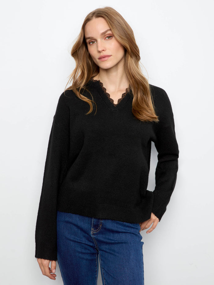 Stylish long-sleeve black sweater, designed for both comfort and elegance in any setting by Charlie B.