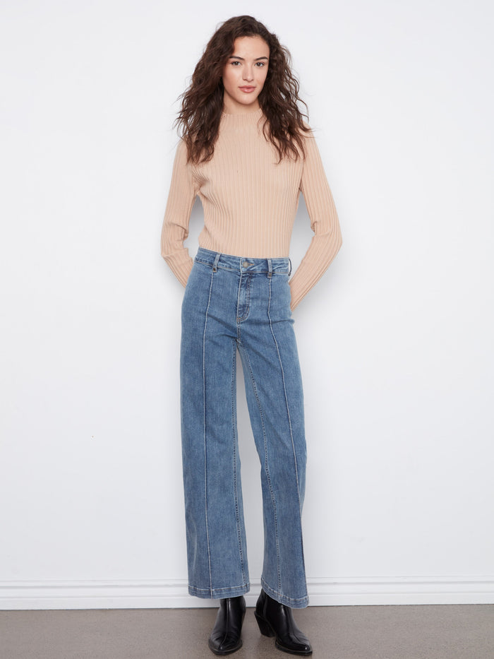 Crafted from stretch denim, these jeans ensure flexibility and ease of movement. By Charlie B.
