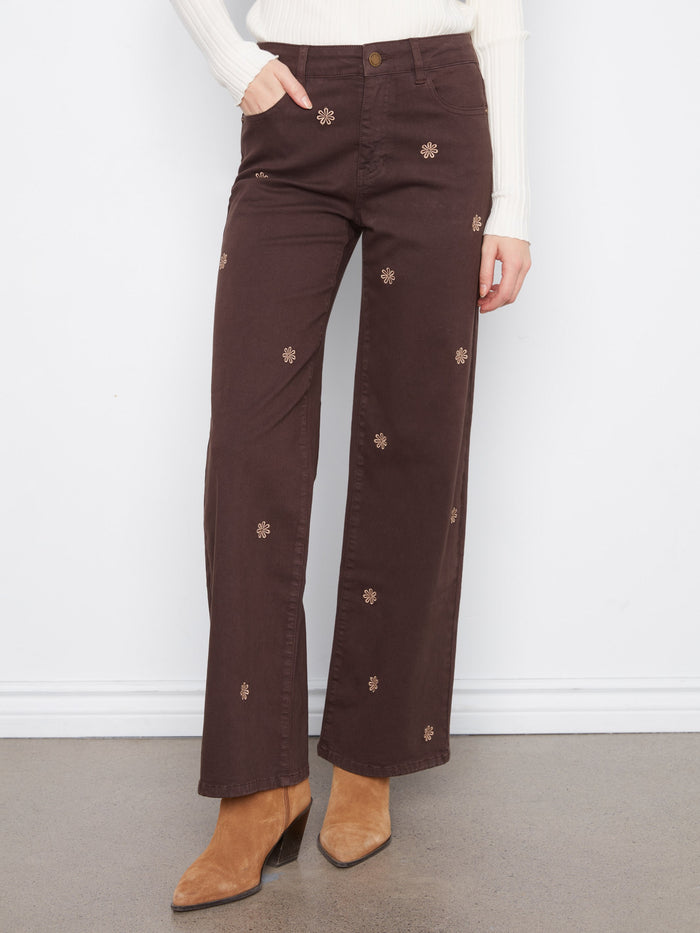 These brown twill pants feature a regular rise and floral embroidery, enhancing their stylish five-pocket design by Charlie B.